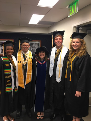 Karen with students at graduation